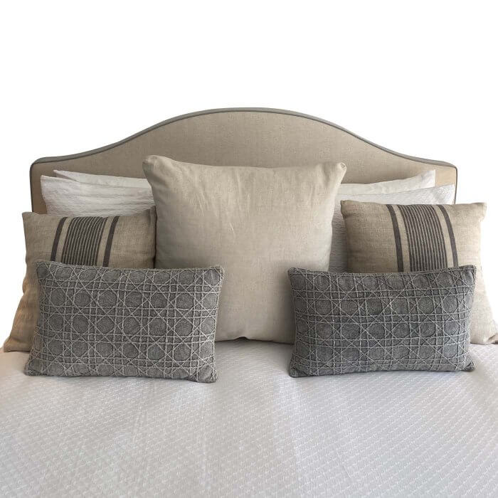 Queen upholstered bedhead in beige with grey piping