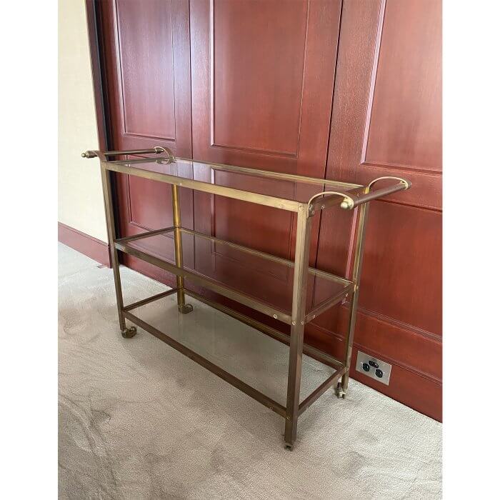 Brass bar cart with glass shelves