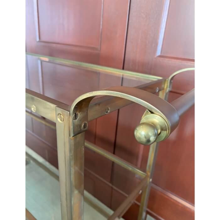 Brass bar cart with glass shelves